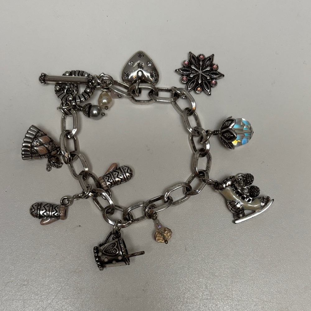 Charming Silver Bracelet with Pink and Pearl Accents featuring winter charms.